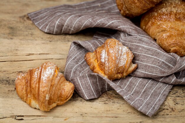 Freshly baked buns with almonds. Croissants and brioches