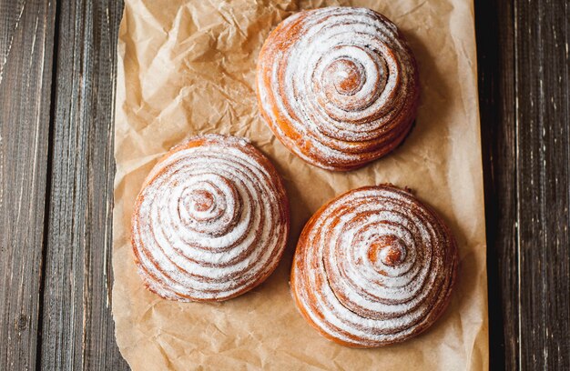 freshly baked buns on a wooden background