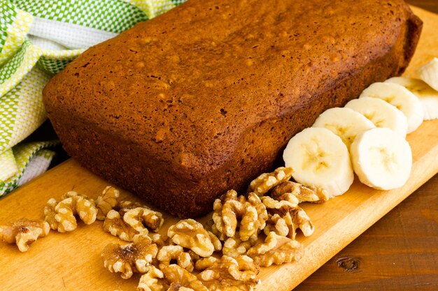 Freshly baked classic banana bread with walnuts and bananas.