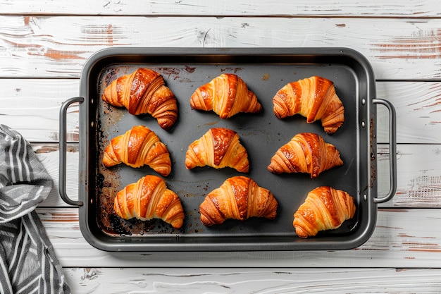 freshly baked croissants on baking pan