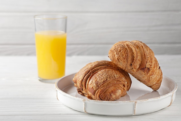 Freshly baked croissants with freshly squeezed orange juice European breakfast