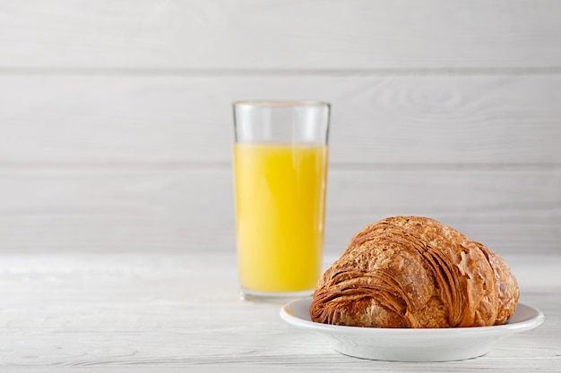 Freshly baked croissants with freshly squeezed orange juice European breakfast