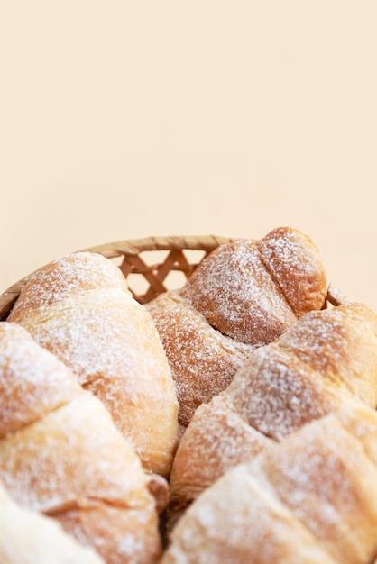 Freshly baked croissants with powdered sugar