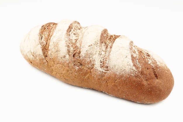 Freshly baked dark bread on a white background