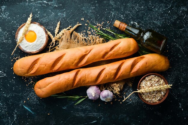 Freshly baked delicious baguette Baking from rye and flour Top view Rustic style