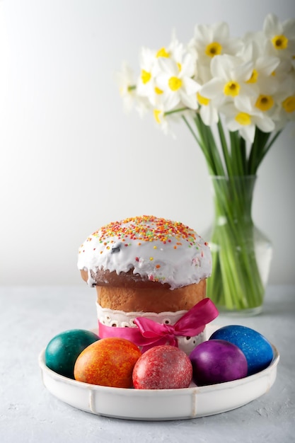 Freshly baked fragrant homemade easter cake with eggs and the first spring flowers