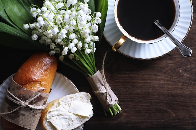 Freshly baked French baguette on a wooden table for breakfast