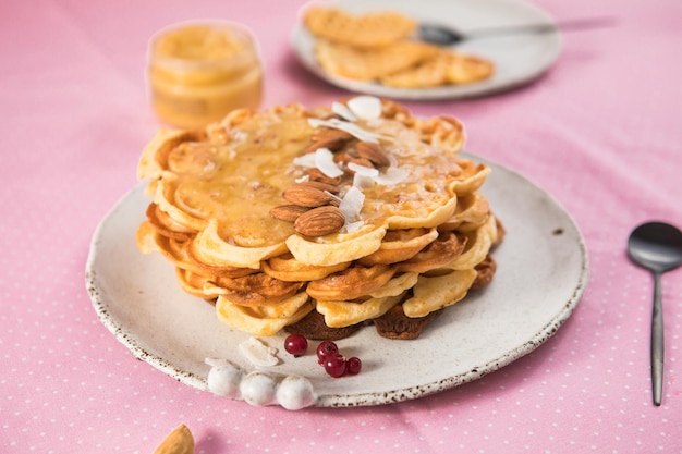 Freshly baked  heart shaped Belgium waffles European baked pastry sweets St Valentines Day