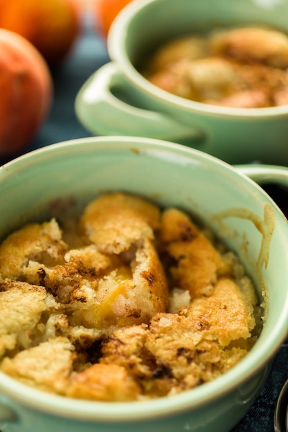 Freshly baked peach cobbler made with organic peaches.