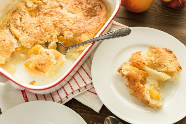 Freshly baked peach cobbler made with organic peaches.