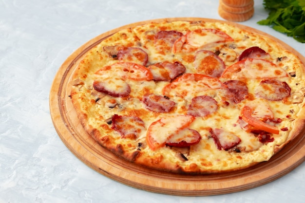 Freshly baked pizza on table close up