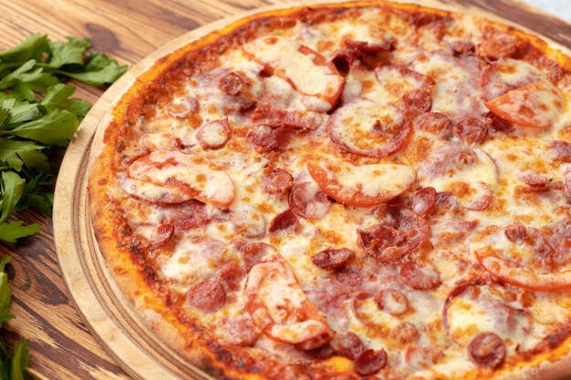 Freshly baked pizza on table close up