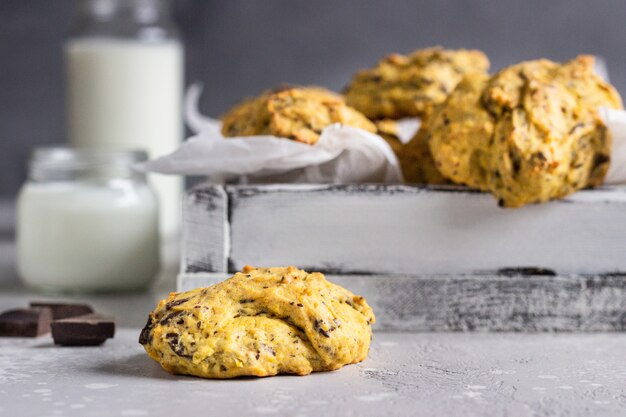 Freshly baked pumpkin cookies with oatmeal and chocolate chips. Healthy snack for breakfast.