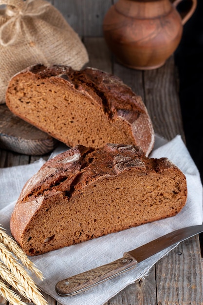 Freshly baked rye bread, close up photo. Homemade sourdough bread. Healthy eating concept.