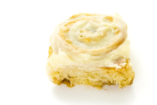 Freshly baked sourdough cinnamon rolls on a white background.