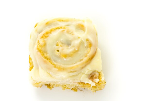 Freshly baked sourdough cinnamon rolls on a white background.