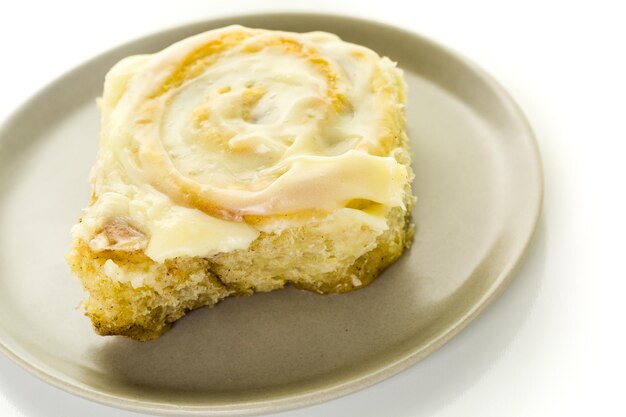 Freshly baked sourdough cinnamon rolls on a white background.