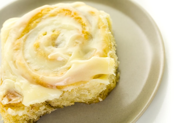 Freshly baked sourdough cinnamon rolls on a white background.