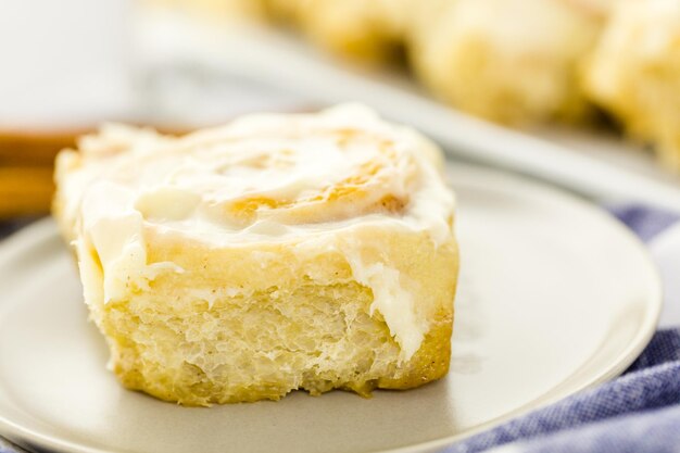 Freshly baked sourdough cinnamon rolls on a white background.