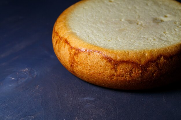 Freshly baked sponge cake with a golden brown crust.