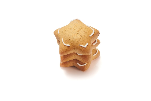 Freshly baked star shaped ginger cookies isolated on white background. Close Up, selective focus view