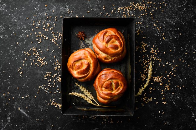 Freshly baked sweet homemade buns Baking from rye and flour Top view Rustic style