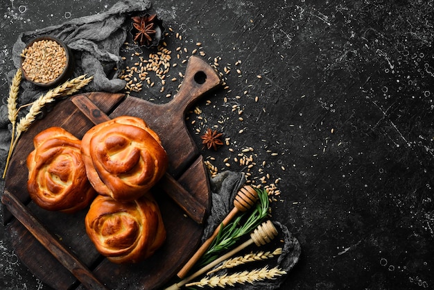 Freshly baked sweet homemade buns Baking from rye and flour Top view Rustic style