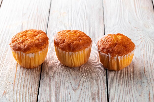 Freshly baked tasty bun on a white wooden table Tasty baked goods straight from the bakery