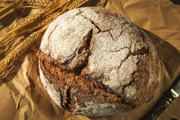 Freshly baked traditional bread on a wooden table yeastfree rye bread closeup rustic style food background