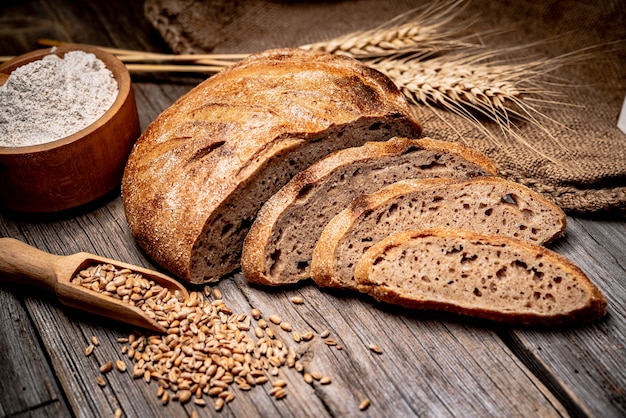 Freshly baked traditional bread on wooden table