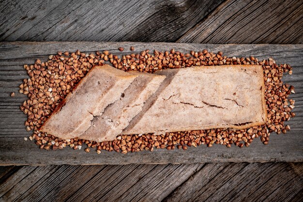 Freshly baked traditional bread on wooden table