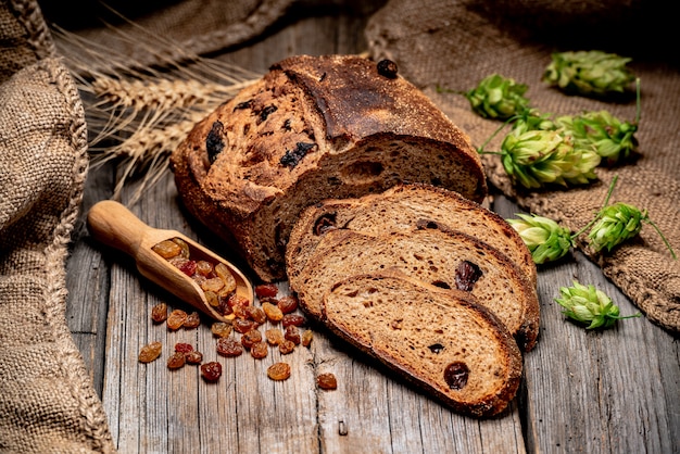 Freshly baked traditional bread on wooden table.