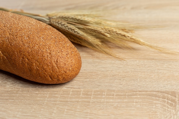 Freshly baked traditional bread on a wooden table