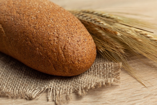 Freshly baked traditional bread on a wooden table