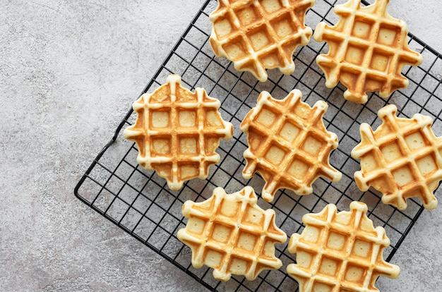 Freshly baked waffles on a baking rack