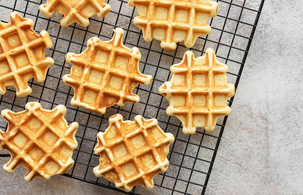 Freshly baked waffles on a baking rack