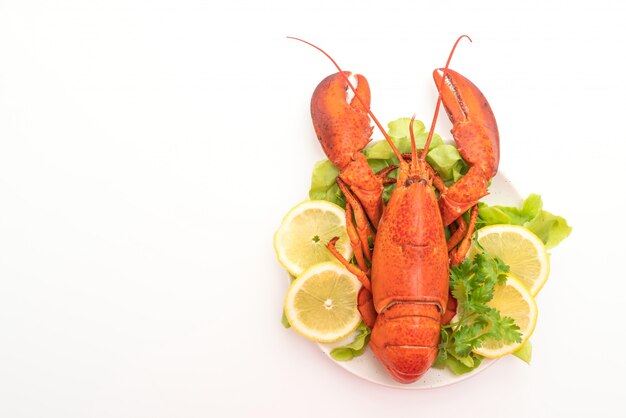 freshly boiled lobster with vegetable and lemon