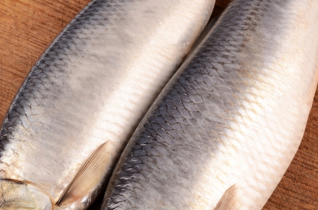 Freshly caught herring on a cutting board