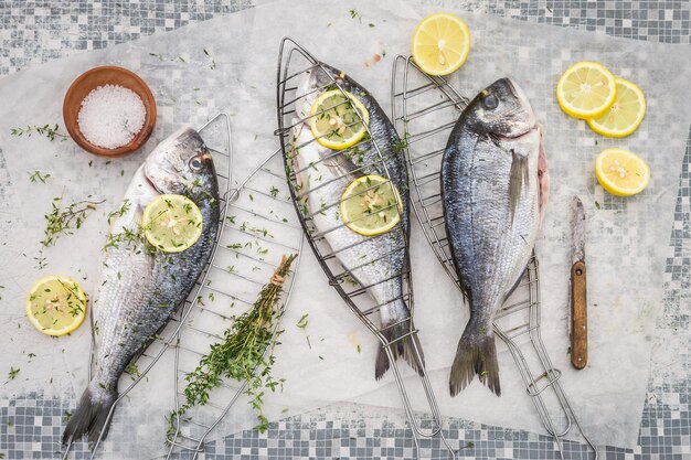 Freshly caught sea bream with thyme and salt for grill