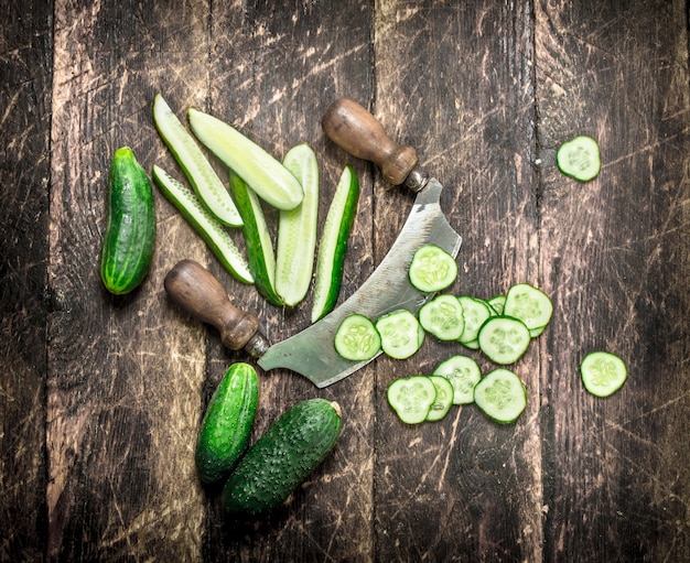 Freshly cut cucumbers with a knife