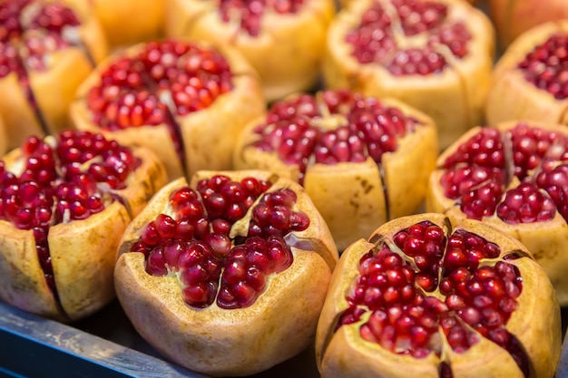 Freshly cut pomegranate fruits for sale at a local market