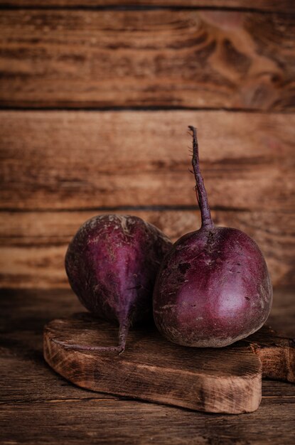 Freshly harvested red beetroot on rustic wood