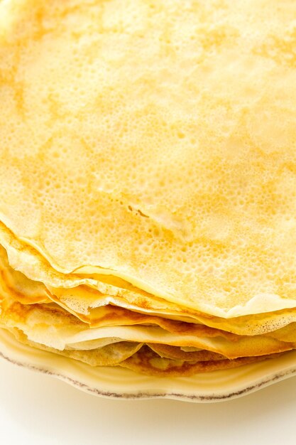 Freshly homemade crepes on a white background.