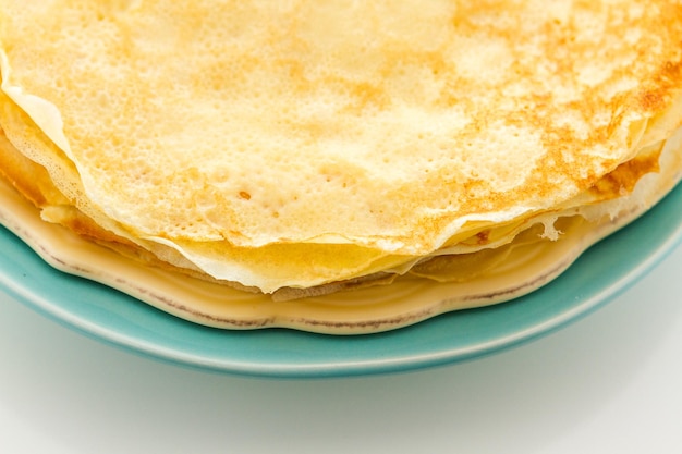 Freshly homemade crepes on a white background.