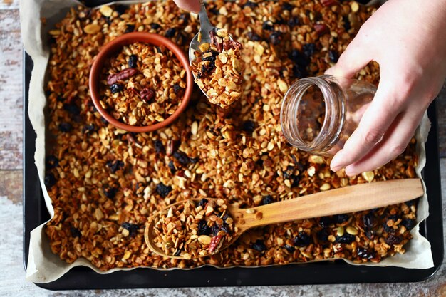 Freshly homemade granola on a baking sheet