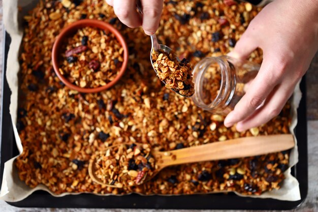 Freshly homemade granola on a baking sheet