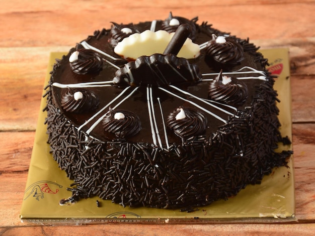 Freshly made belgium cream cake on wooden table selective focus