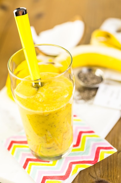 Freshly made mango banana smoothie with chia seeds.