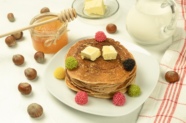 Freshly made pancakes with jam for breakfast