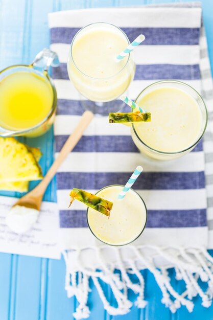 Freshly made pineapple ginger smoothie with Greek yogurt and juice.